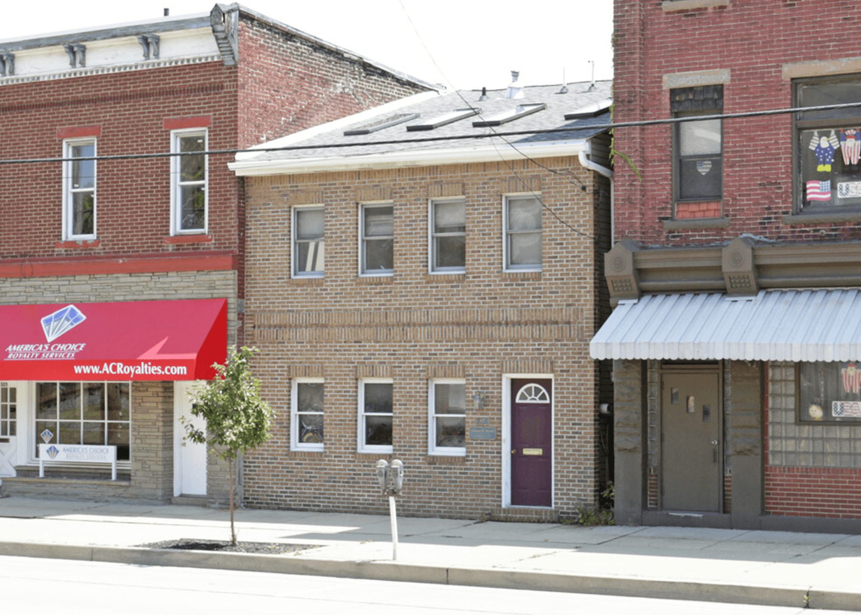 Exterior of 327 West Main Street: Two story brick building