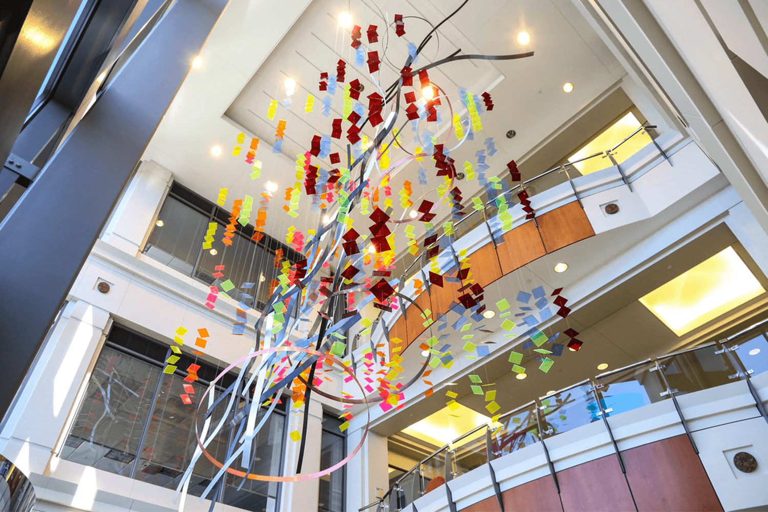 Vibrant hanging sculpture than spans multiple levels