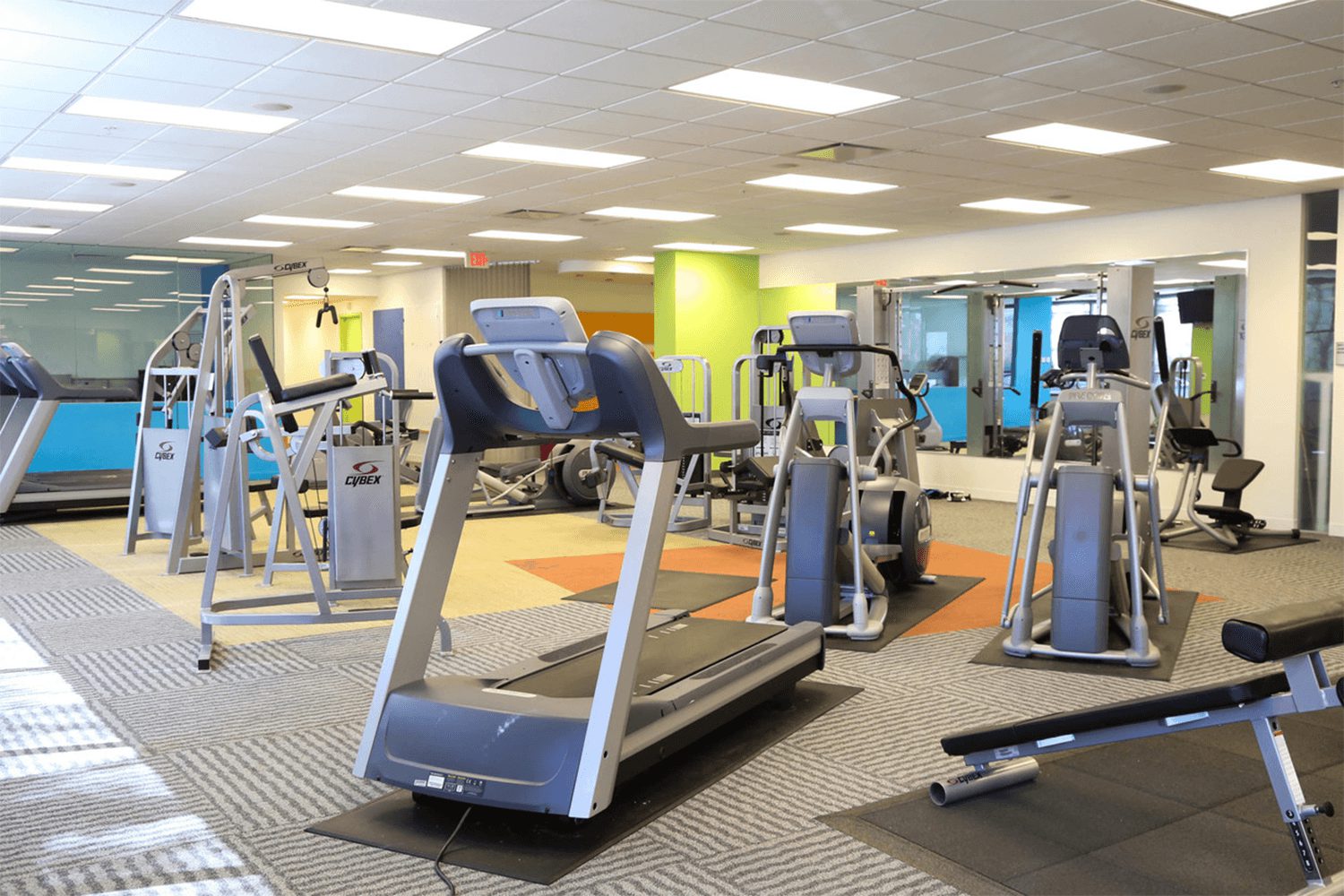 fitness center with a treadmill and other gym equipment