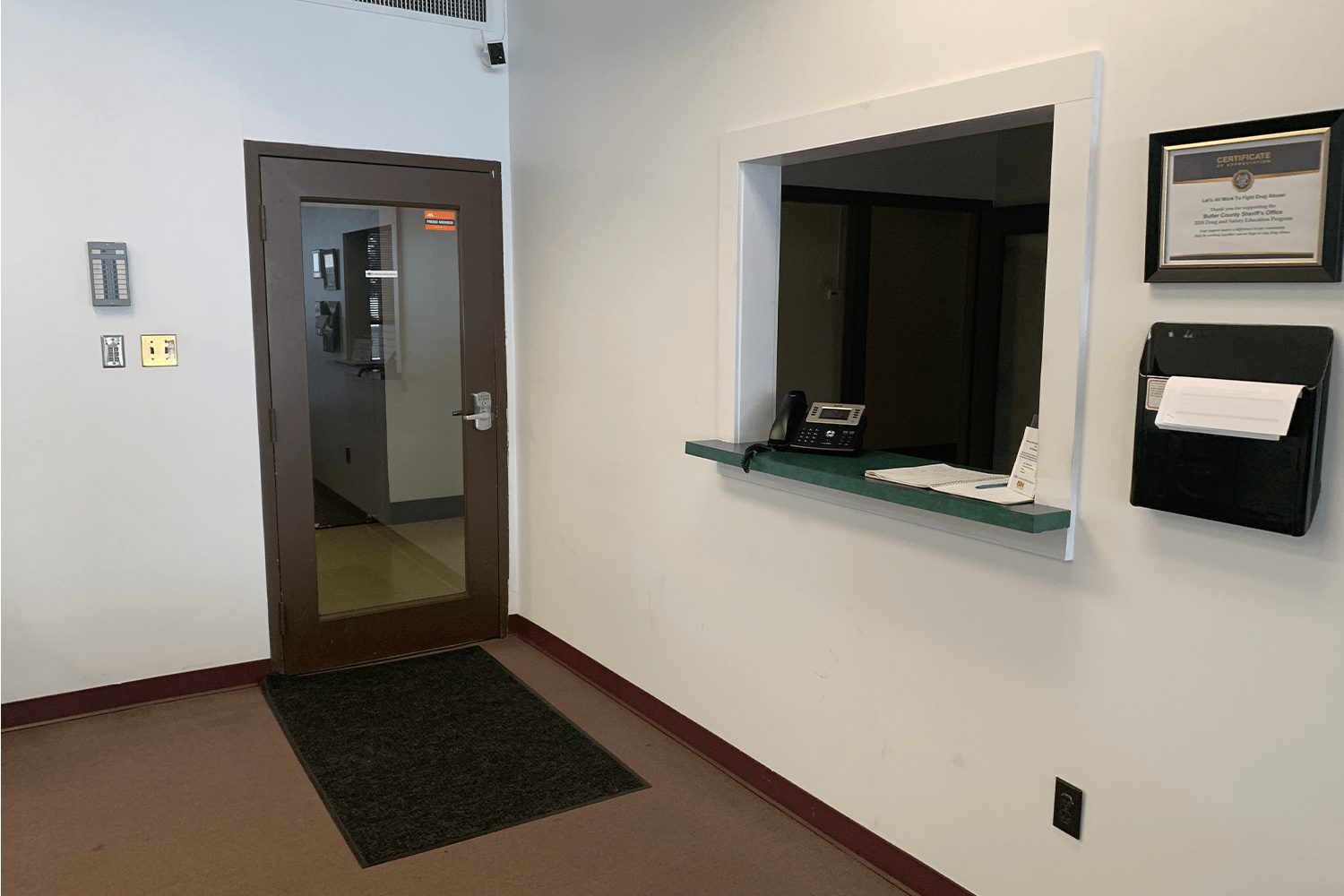 Entrance/reception area with a help desk window