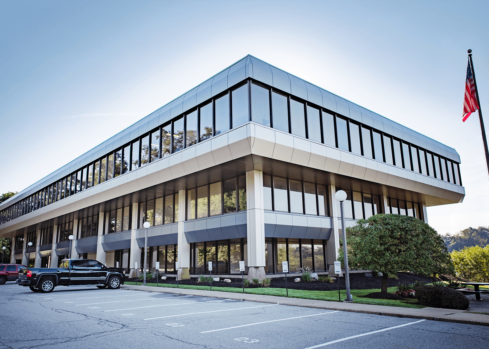Exterior of Foster 0 office building-three story tan building with large windows
