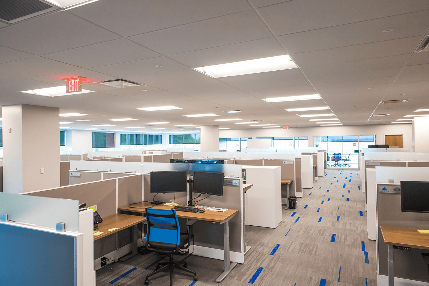 large office space with rows of cubicles