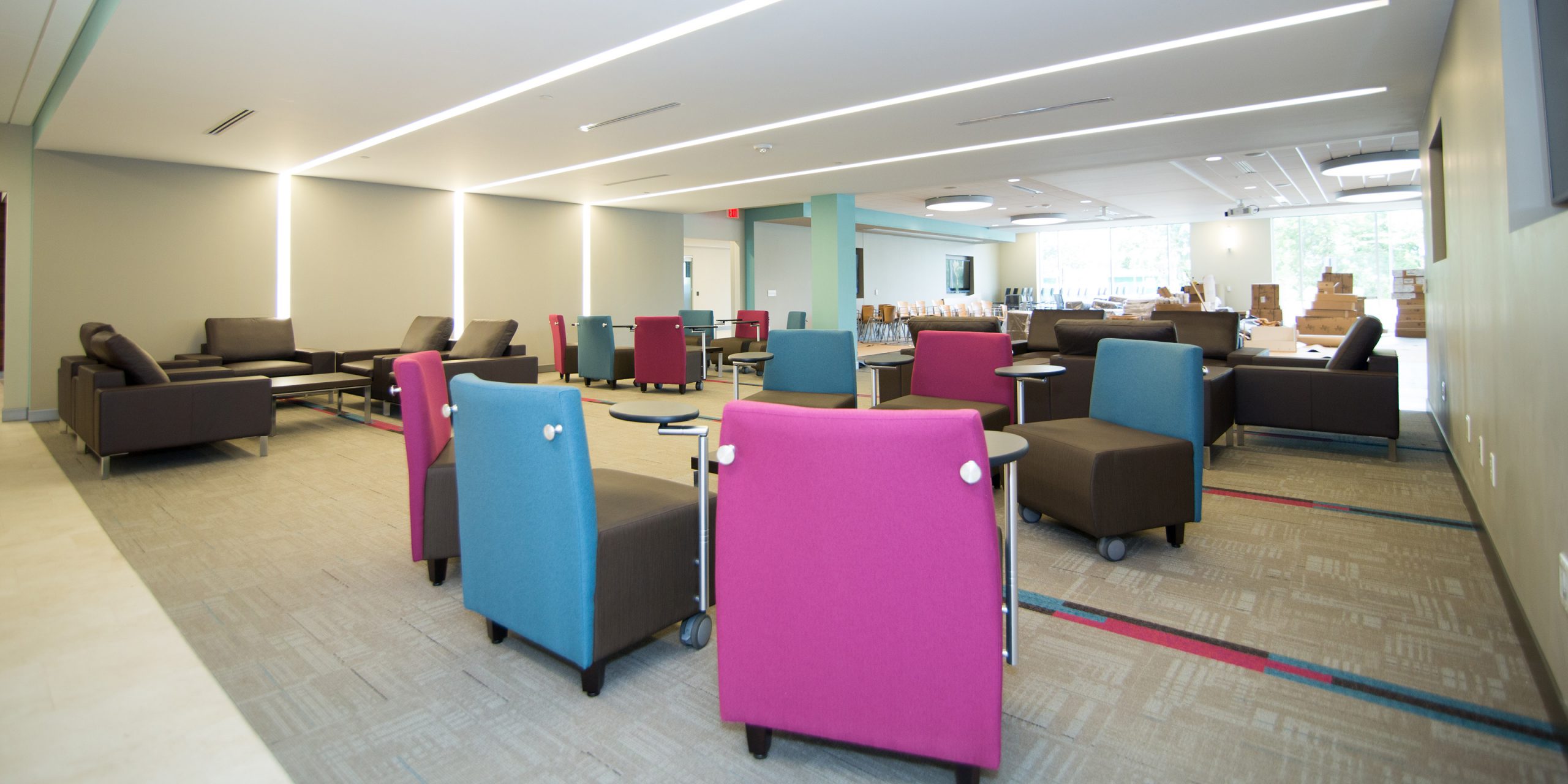 blue, pinks, and gray furniture in a collaborative office space