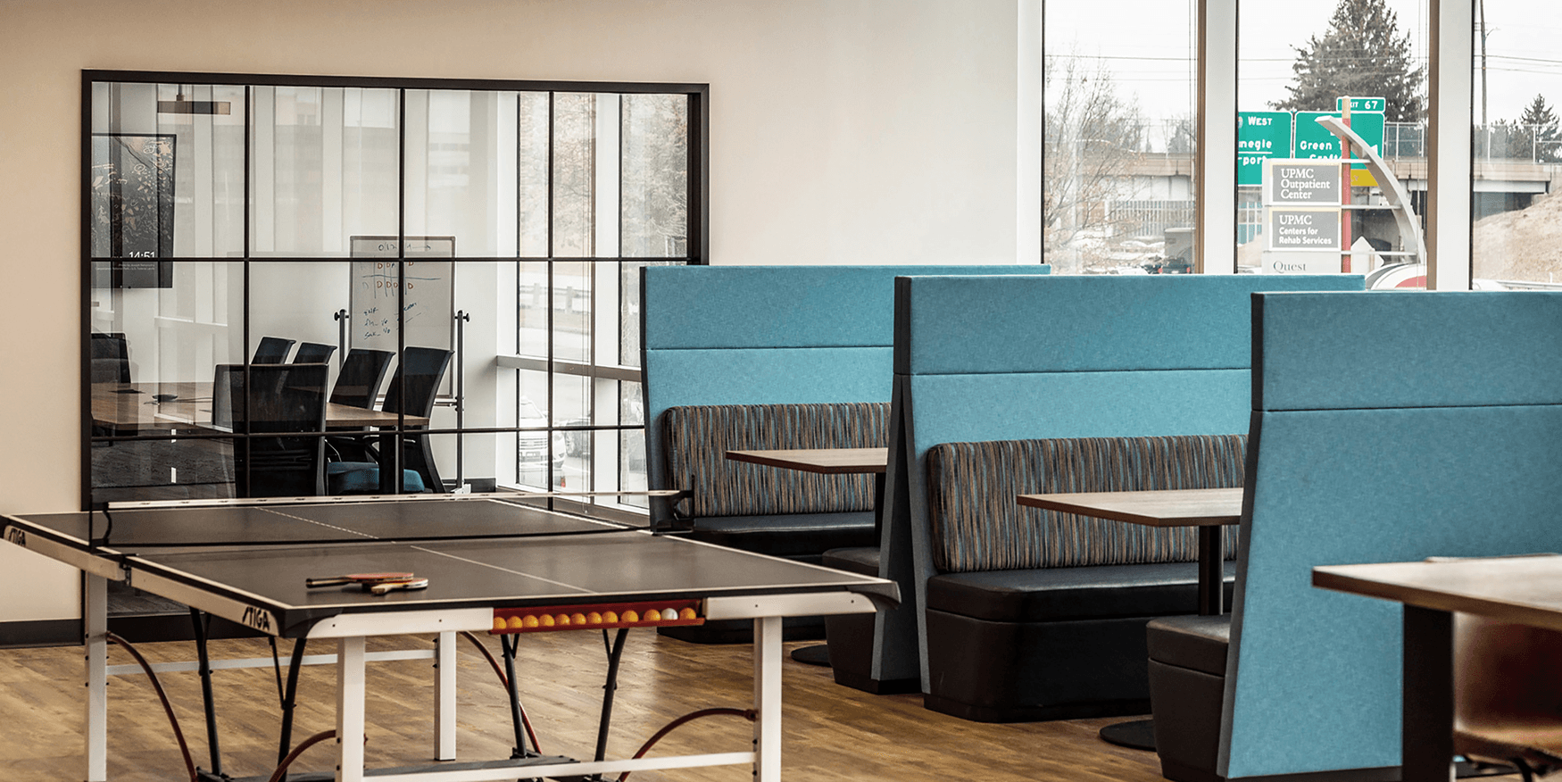 collaborative workspace with ping pong table and booths