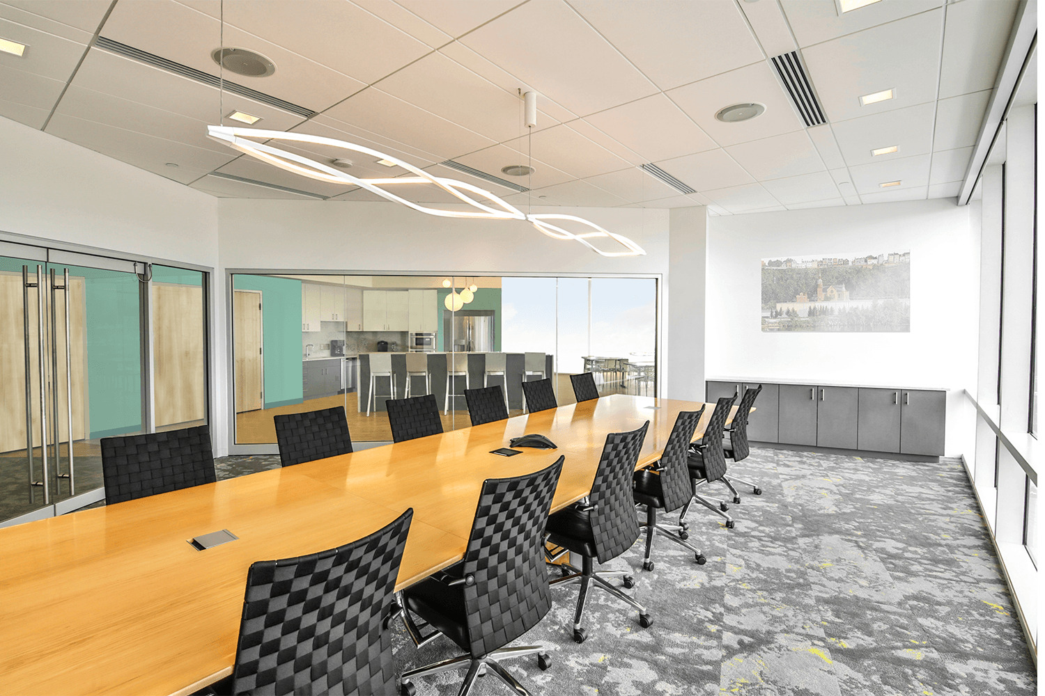 bright white conference room with a large table and chairs