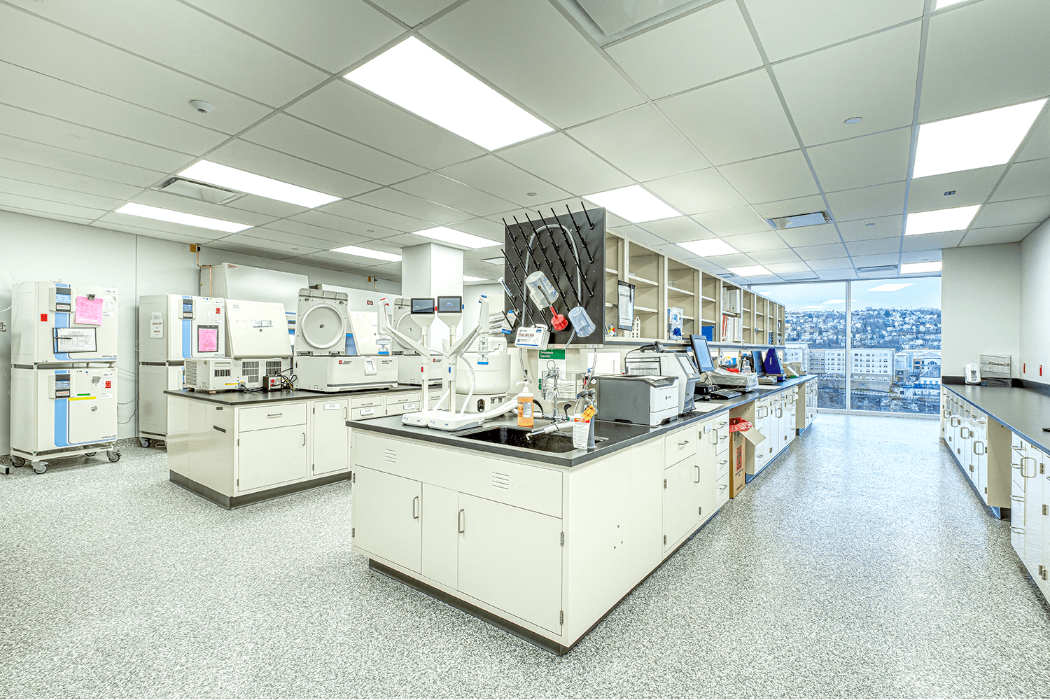 wet lab workspace with shelves and lab equipment