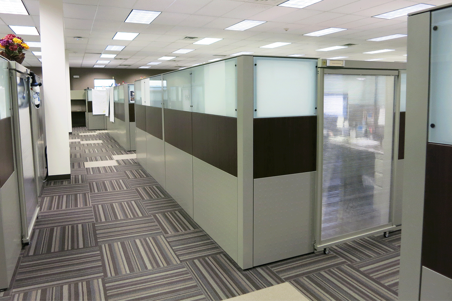 hallway with office cubicles