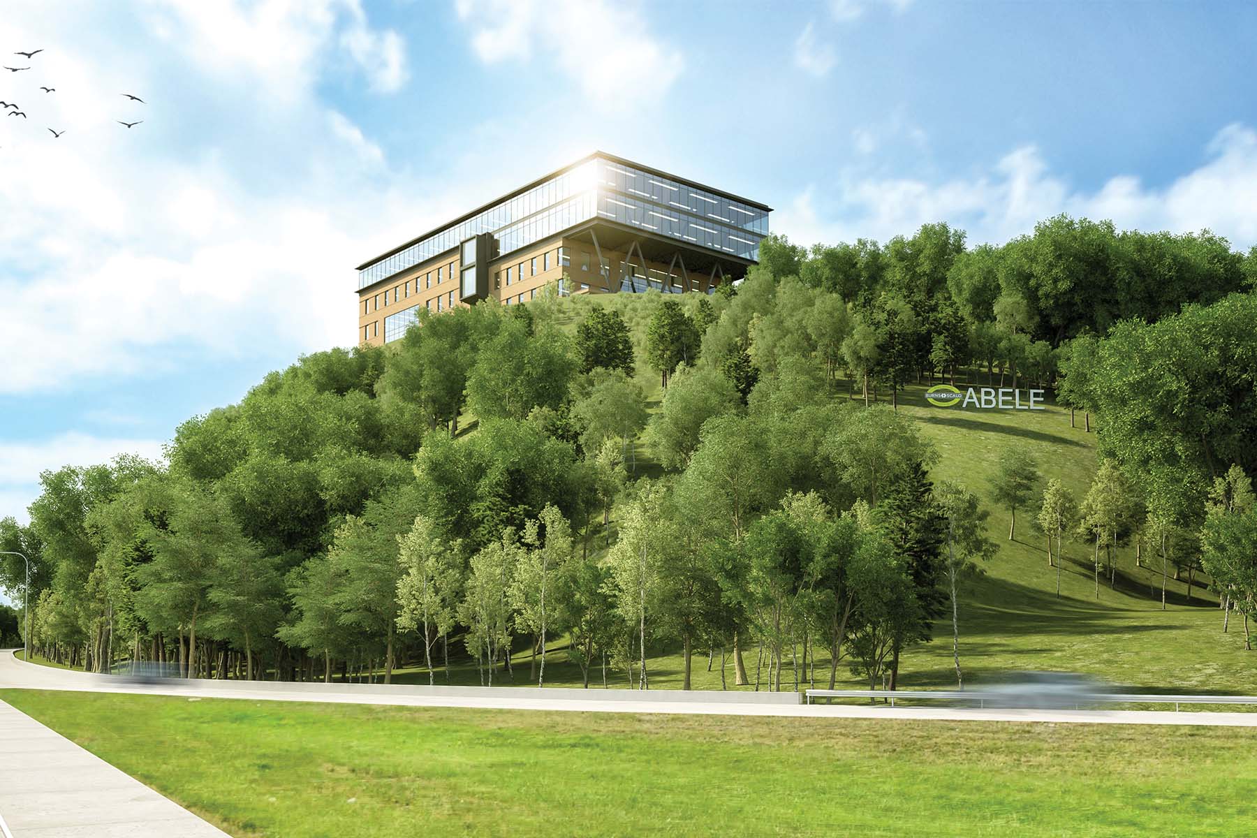 Office building perched at the top of a hill overlooking an interstate exit and field of trees