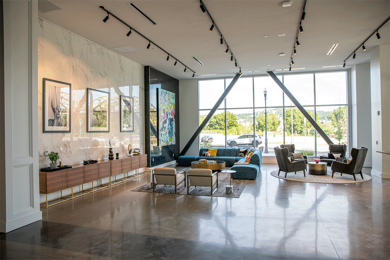 wide angle of lobby space with furniture and large windows