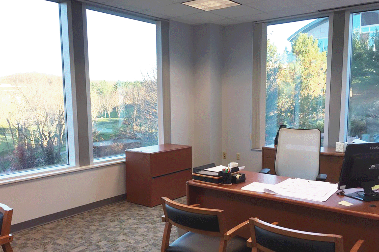 private office with desk and chairs