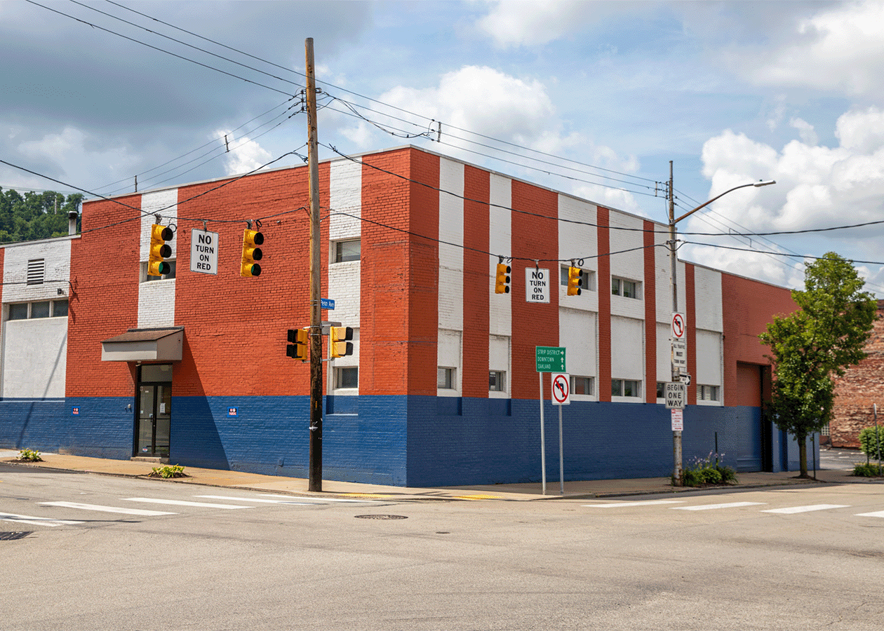 orange white and blue building on corner