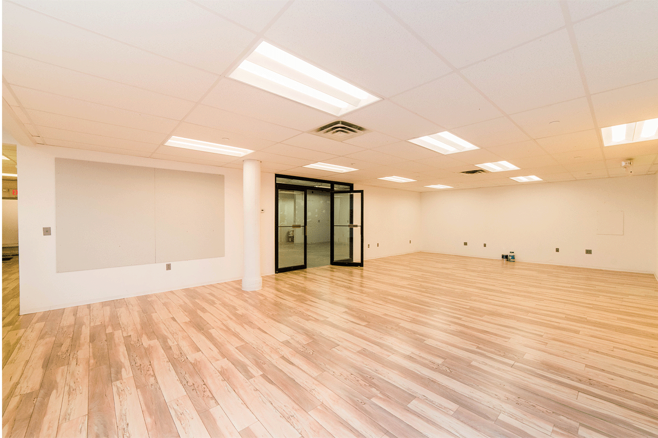 large empty room with hardwood floors