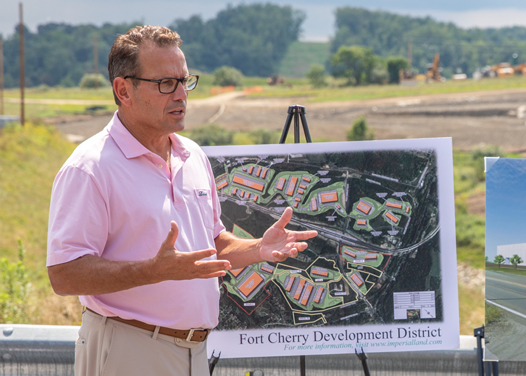 jim scalo speaking to a group presenting the fort cherry development district plans on an easel